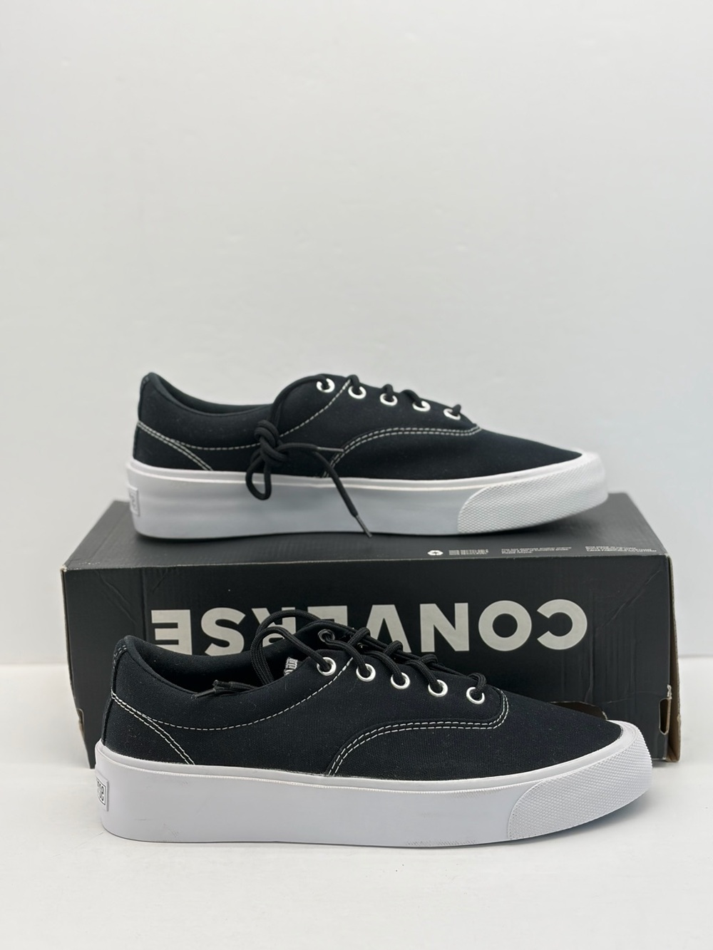 Converse men’s Black Canvas Low-Profile Sneakers with White Sole